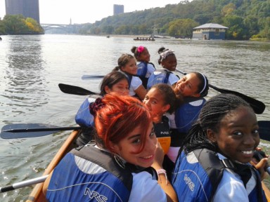 Students paddle on the Harlem River in the Bronx, NY